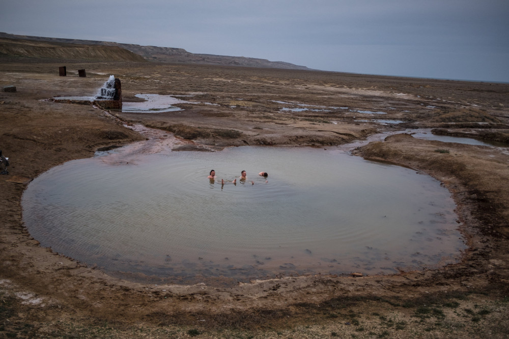 Tourists enjoying the hot water from a spring that emerged on the former Aral seabed near the village of Akespe, Kazakhstan. Sergey Ponomarev for The New York Times